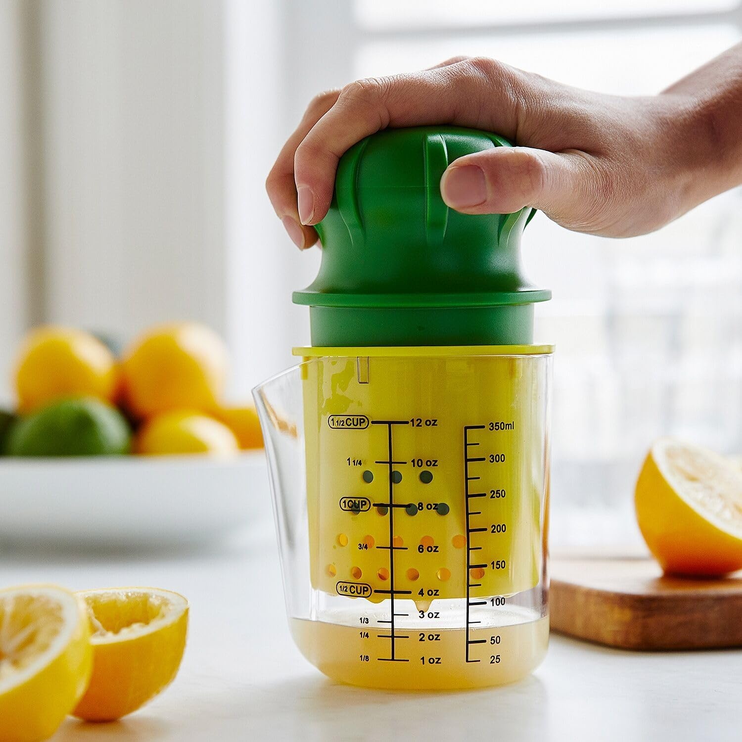 image:imageSur La Table Manual Citrus Juicer HighPerformance Hand Juicer with Clear Measuring Cup Yellow Reaming Cone Green Plunger amp Metal Prong for Maximum Juice Extraction