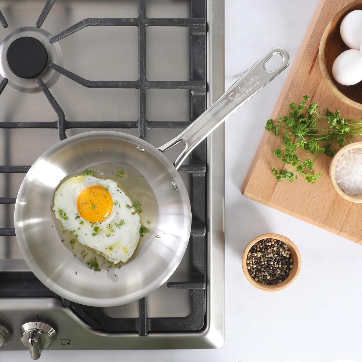 image:imageSur La Table Kitchen Essentials Chefs Deck 3Piece 53Quart Stainless Steel Dutch Oven with Steamer Insert amp Glass Lid Induction Ready TriPly Base Polished Finish amp Hollow StayCool HandlesStainless Steel